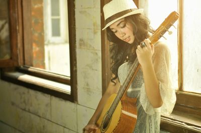 woman holding a guitar